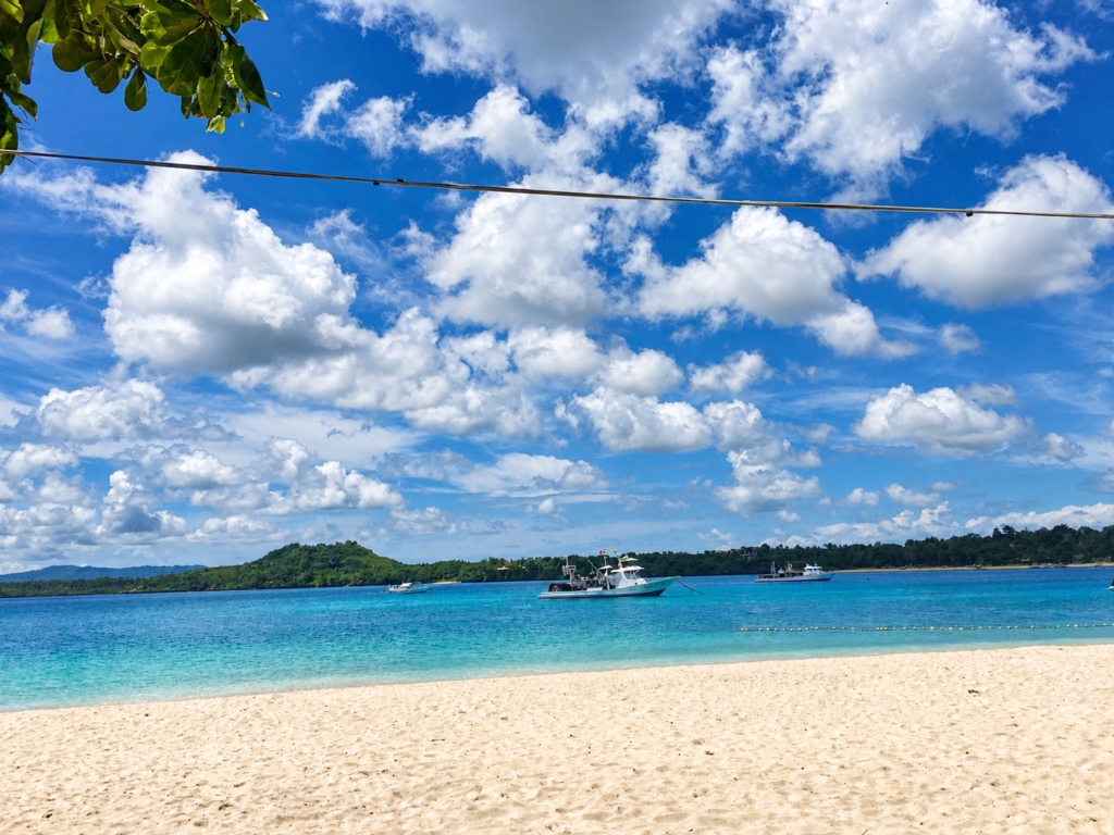 Serene white beach in Tulang Diot Island, Camotes, Philippines.